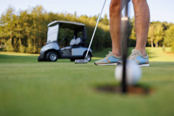 istock Golf Enthusiast: Man Playing with Cart in View 1842863664
