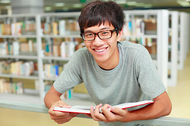 istock portrait of young college student in library 184286528