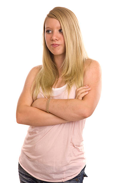 A grown woman of European appearance with long hair and bright makeup in dark clothes for advertising on a bright background. High quality photo