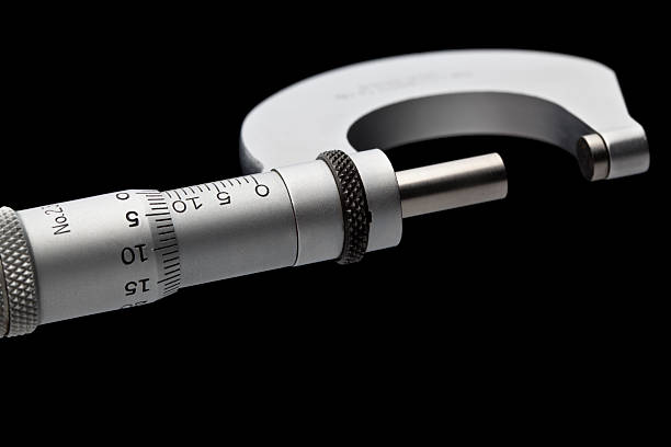 istock Micrometer measurement isolated on clean black background 184286624