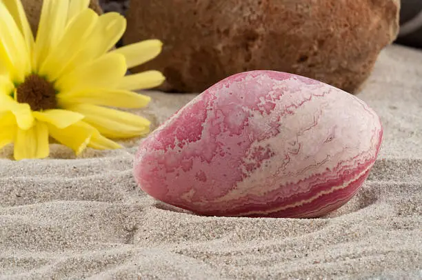 Photo collection of half-precious stones and gem stones. Here shown: Rhodochrosite. 