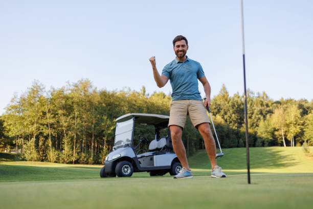 istock Finishing Touch: Golfer, Cart, and Last Hole 1842867347