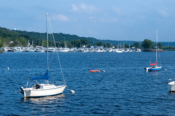 St. Croix River in Hudson, Wisconsin Sailboats and yachts on the St. Croix River bordering Minnesota and Wisconsin. hudson stock pictures, royalty-free photos & images