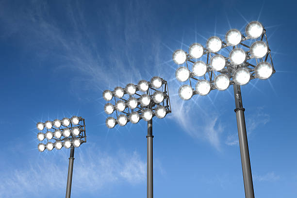 Stadium Lights Large stadium lights on a sky background.Could be a useful element in a sports composition.This is a detailed 3d rendering. floodlight stock pictures, royalty-free photos & images