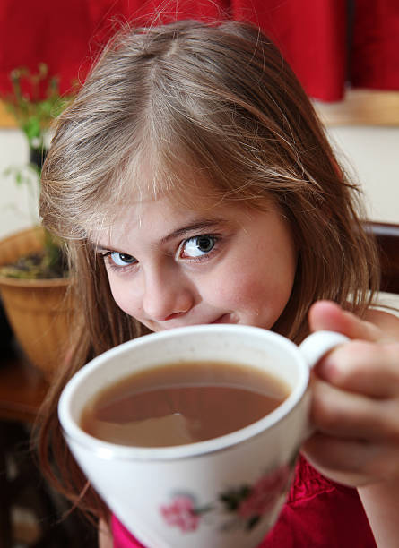 istock Little girl with teacup 184287352