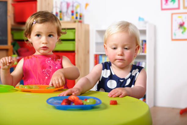 istock Toddlers Having Healthy Snacks In A Nursery 184287617