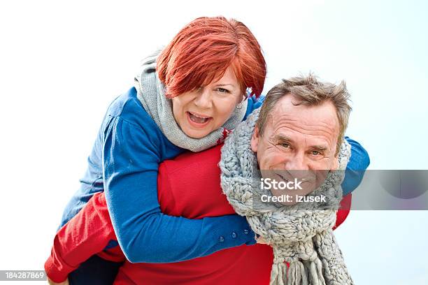 Happy Seniors Giving Piggyback Ride Stock Photo - Download Image Now - Active Seniors, Adult, Adults Only
