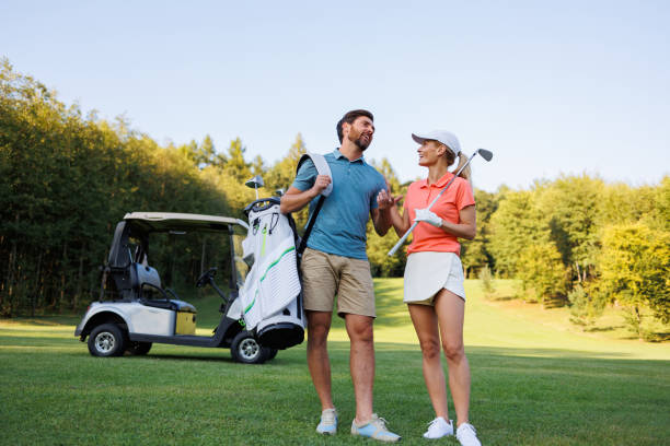 istock Elegant Golfer Duo Engaging in Golf Course Play 1842879142
