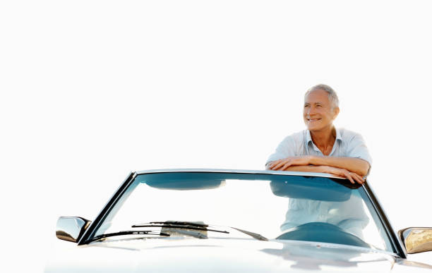 istock Smiling senior man leaning on his car 184287918