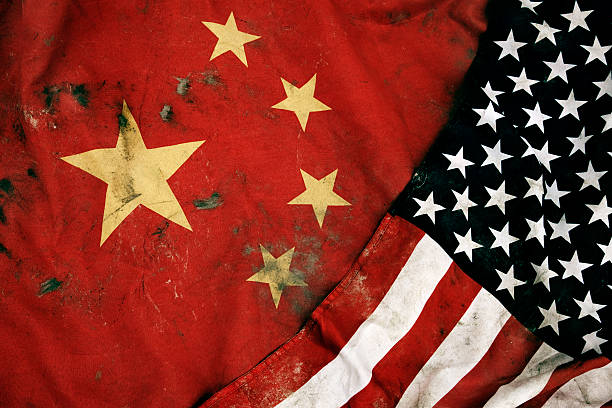 Grungy Flags of China and USA Low key photography of grungy old flags of China and USA. cross processed stock pictures, royalty-free photos & images