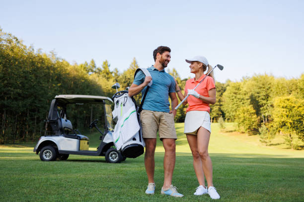 istock Sporty Romance: Young Couple at the Golf Course 1842880180