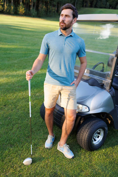istock On-Course Golfer and Cart Scene 1842880210
