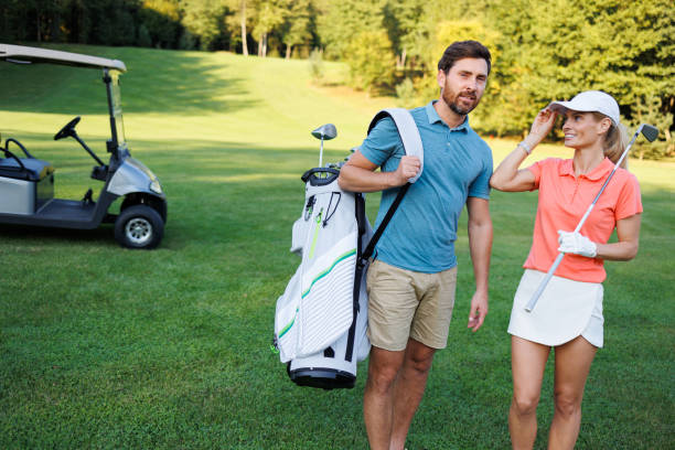 istock Young Couple Enjoying Golf Course Adventure 1842880759