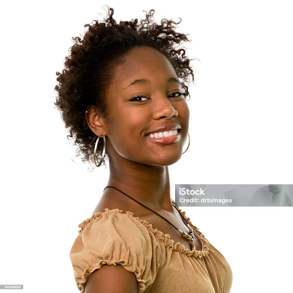 Young woman wearing gold hooped earrings is smiling Portrait of a woman on a white background. White Background Stock Photo