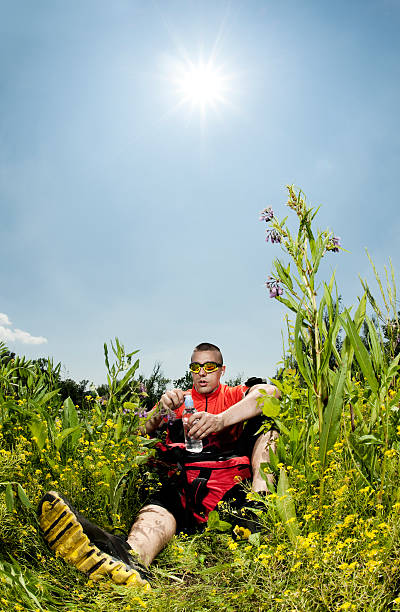 istock Hiker taking a brake in the field 184288122