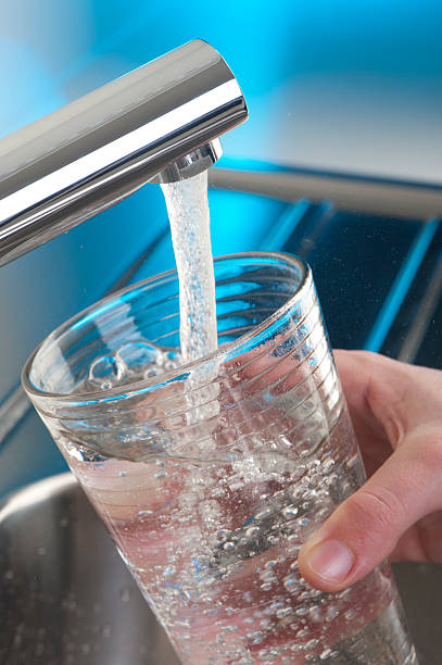 istock Filling up a glass of water 184288405