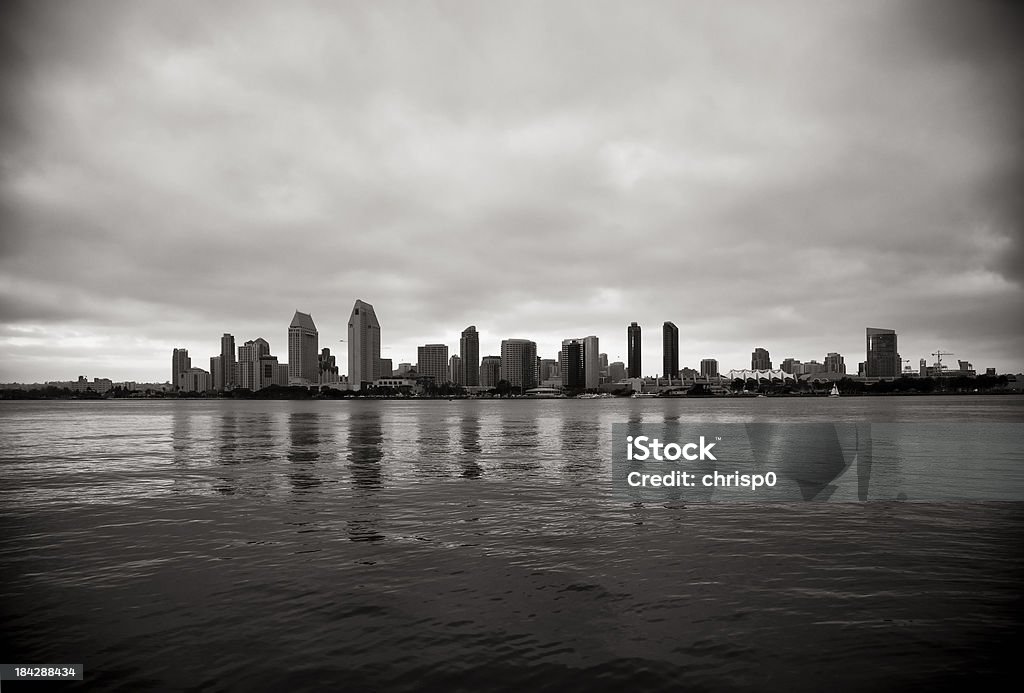 San Diego Skyline and Bay "Black and white view of the San Diego at sunset from across the bay with dramatic clouds overhead.For more San Diego images, see:" Architecture Stock Photo
