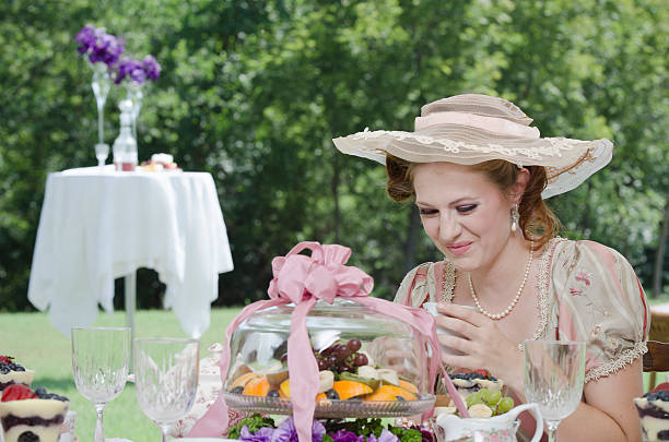 istock Victorian Woman Enjoying a Tea Party 184288475