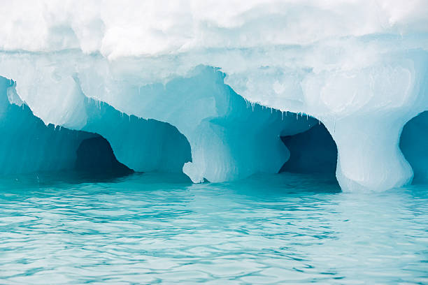 istock Blue iceberg with reflection drifting in the arctic ozean 184288540