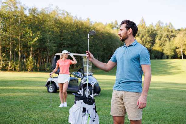 istock Youthful Pair Enjoying Golf Outdoors 1842889667