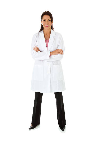 Smiling mid adult female wearing lab coat arms crossed "Smiling woman wearing lab coat, arms crossed, full length, isolated on white background" laboratory coat stock pictures, royalty-free photos & images