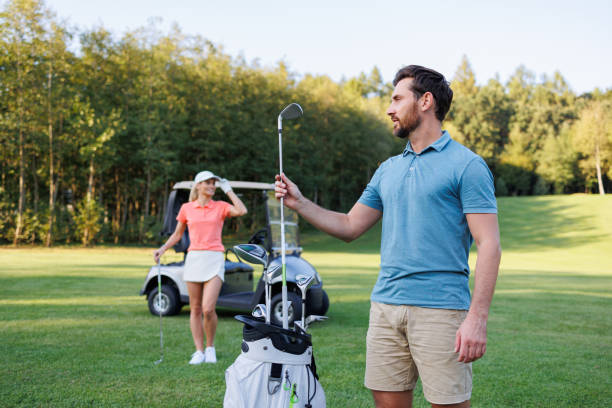 istock Couple Golfing Amidst Serene Landscape 1842890290