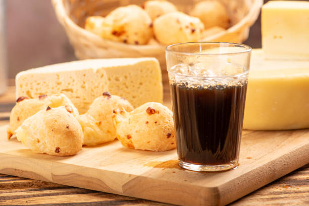 istock Cheese bread and cheese, a table with cheese bread and pieces of cheese and a glass of coffee on a rustic table, selective focus. 1842890708
