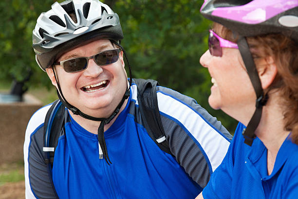istock Happy Biker Laughing With Bike Partner 184289093