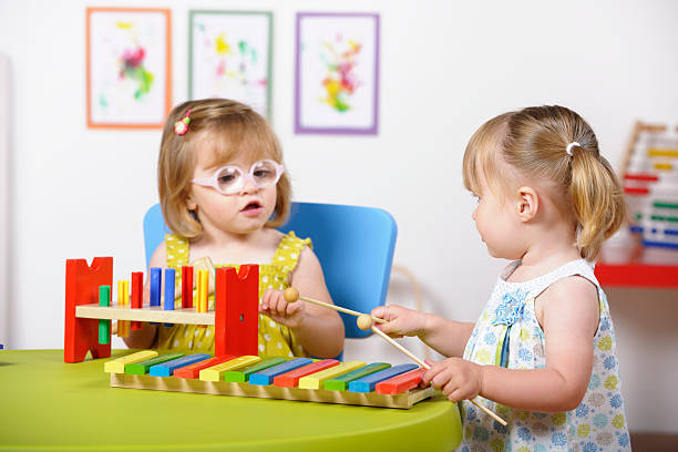 istock Toddlers Interacting During Playtime In A Nursery Setting 184289117