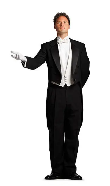 A butler or a Maitre D in a welcoming gesture.