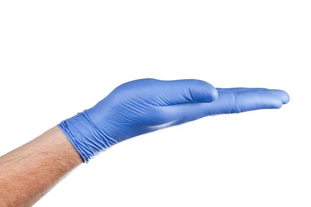 Hand in blue surgical glove. Isolated on pure white.See also: