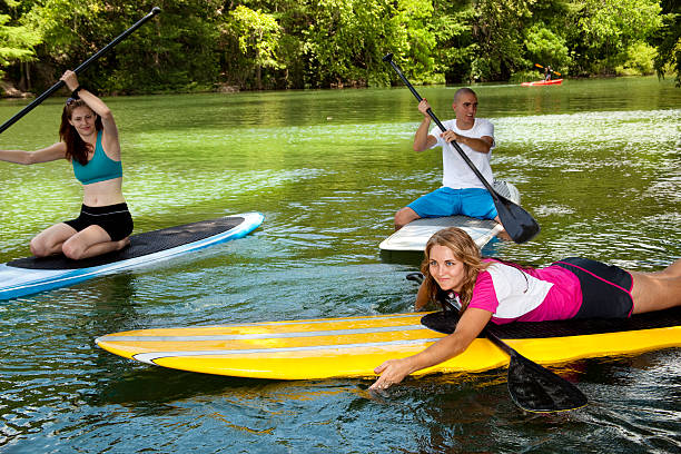 istock Three happy young adults on paddleboards in Colorado River. 184289289