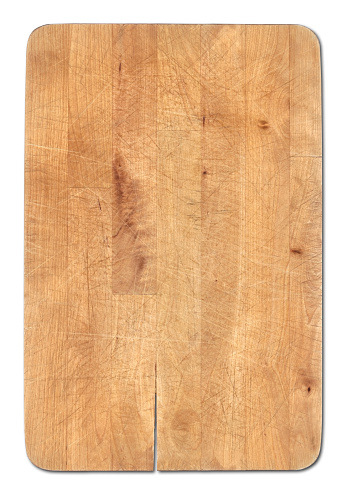 Wooden bread cutting board isolated on white background. Knife's cuts visible. Clipping path included.