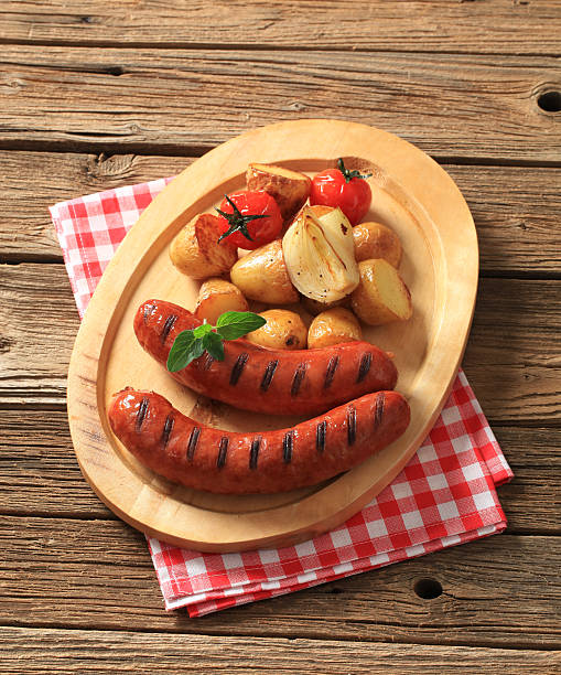istock Grilled sausages and roasted potatoes 184289656
