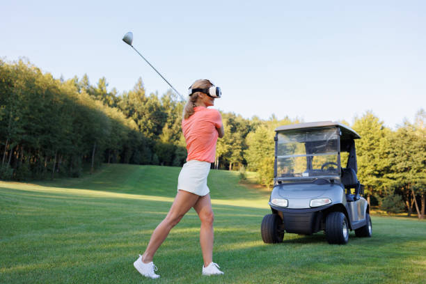 istock Blonde Golfer Immersed in Virtual Reality on Golf Course 1842898532