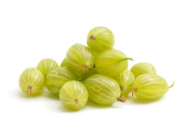 Gooseberries in a heap isolated on a white background.