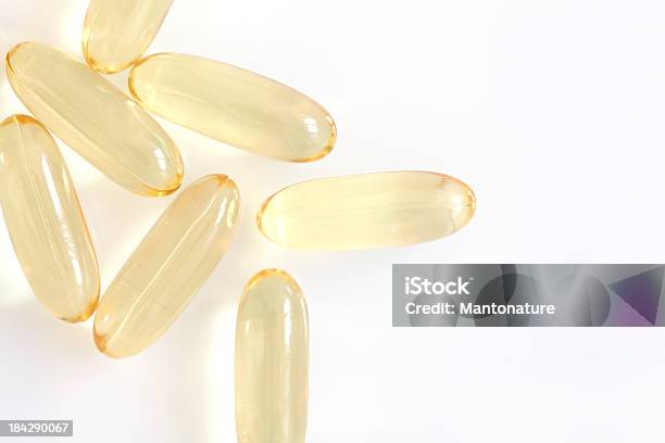 Capsules With Fish Oil On White Stock Photo - Download Image Now - Alternative Medicine, Beauty, Bright