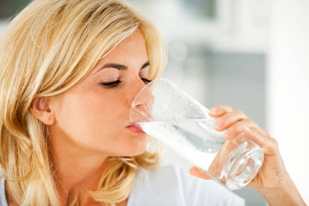 istock Beautiful woman drinking water 184290105