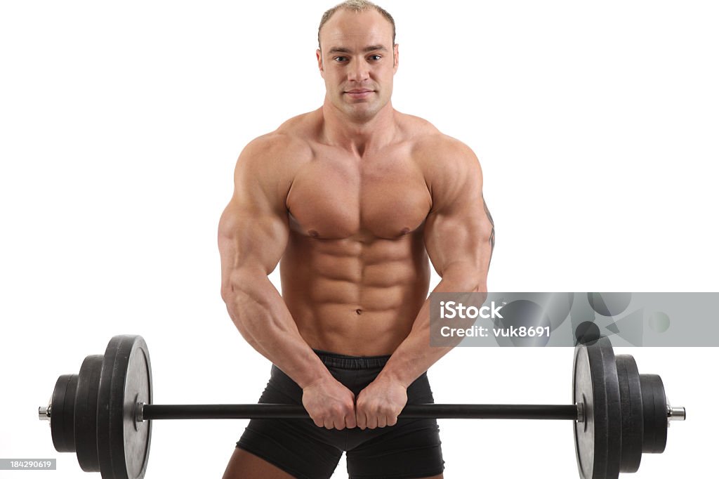 Exercising Bodybuilder exercising-isolated on white background Abdomen Stock Photo