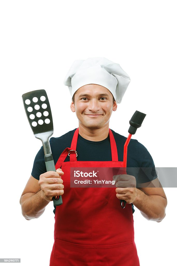 Szczęśliwy człowiek w kuchni smażenia czerwone na białym tle - Zbiór zdjęć royalty-free (Kucharz)