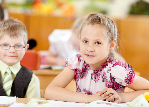 istock Smiling cute girl in the classroom 184290825