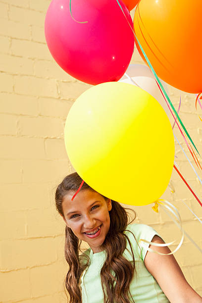 istock Girl with balloons 184291099