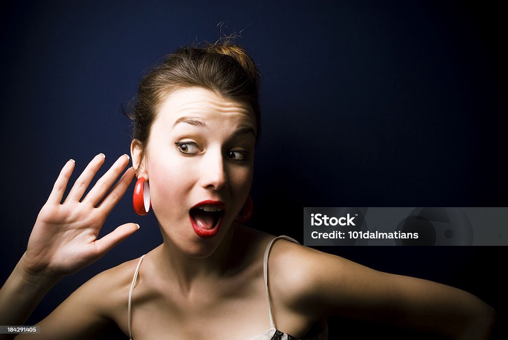 Curios Woman Young woman trying to listening.. Ear Stock Photo