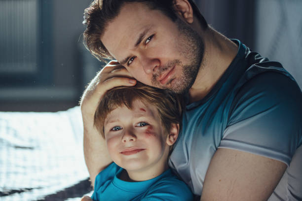 istock Father pities his son with scratches on his face 1842917186