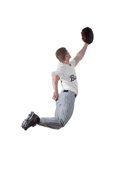 istock Basball player jumping to catch the ball 184291986