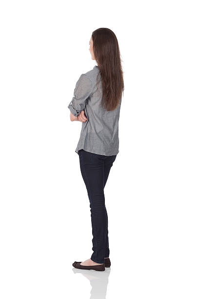 woman standing with arms crossed stock photo
