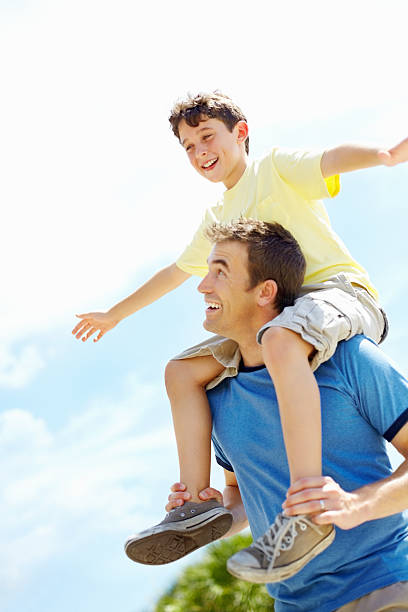 istock Son on his father's shoulders having fun 184292385