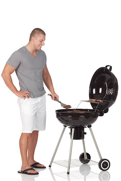 istock Man preparing food in a barbecue grill 184292436