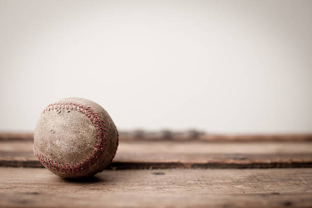 istock Old, Worn Baseball on Antique Wooden Trunk 184292672
