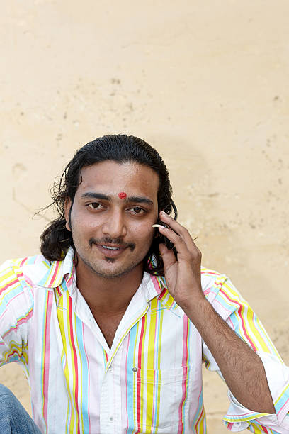 istock Handsome 22 year old asian man on cellphone portrait 184292784